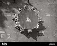 a-rescue-team-hold-a-life-net-used-to-catch-victims-jumping-from-a-high-rise-fire-circa-1950-2...jpg