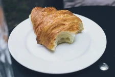 bitten_butter_croissant_on_a_plate-1024x683.webp